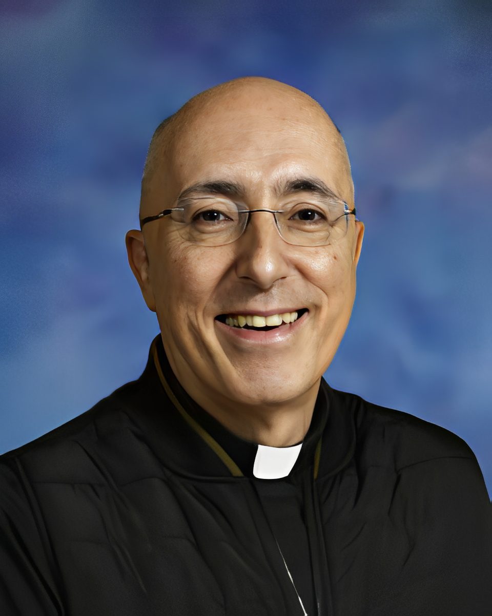 Bald man against a blue background