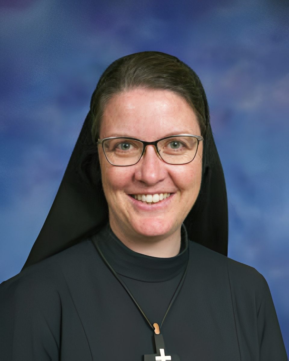 Happy nun wearing a cross necklace