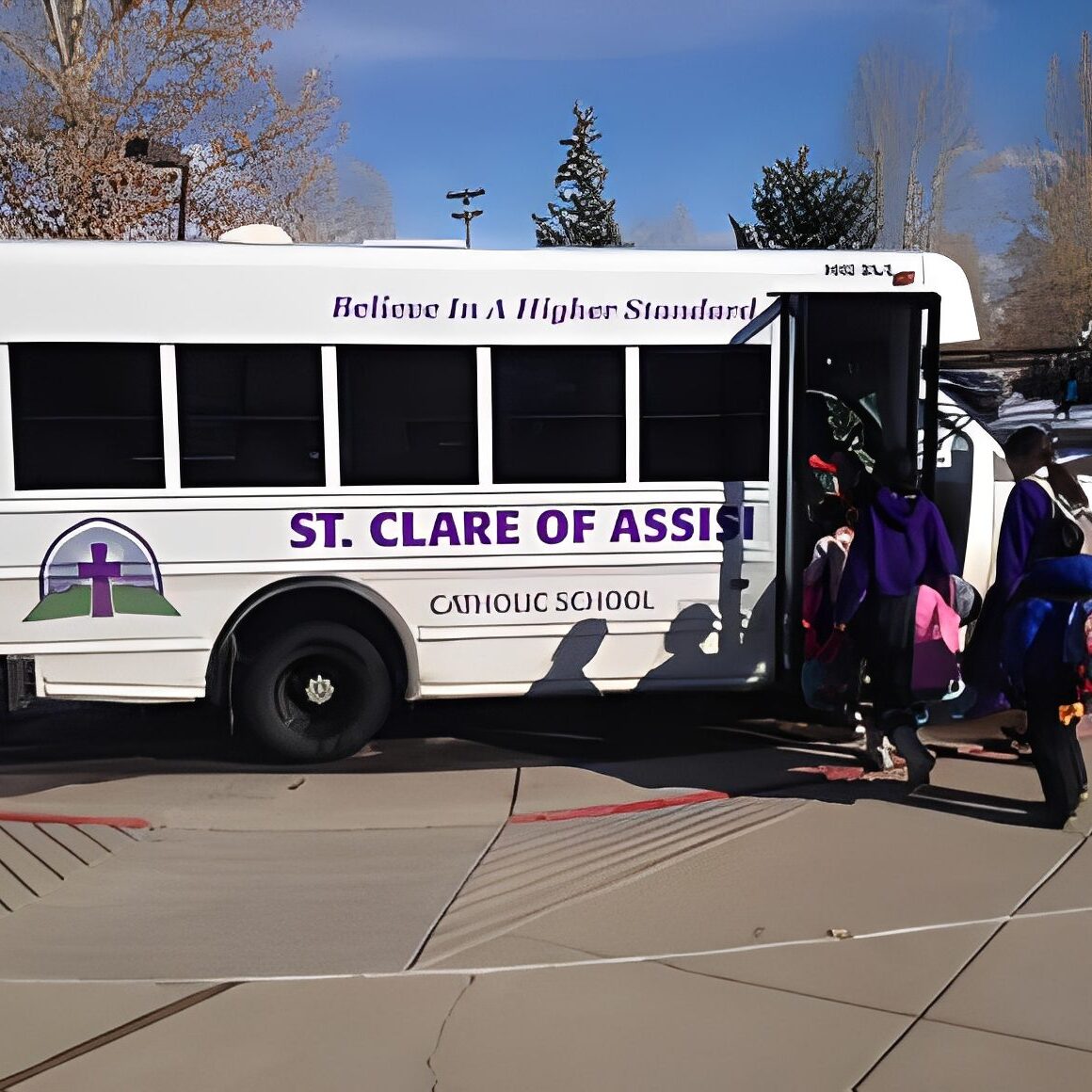 Children entering a white school bus